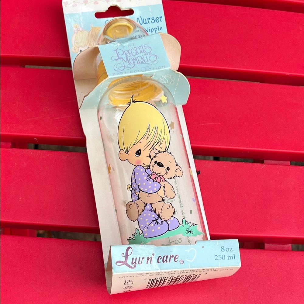 Precious Moments Baby Bottle with Yellow and Purple Design